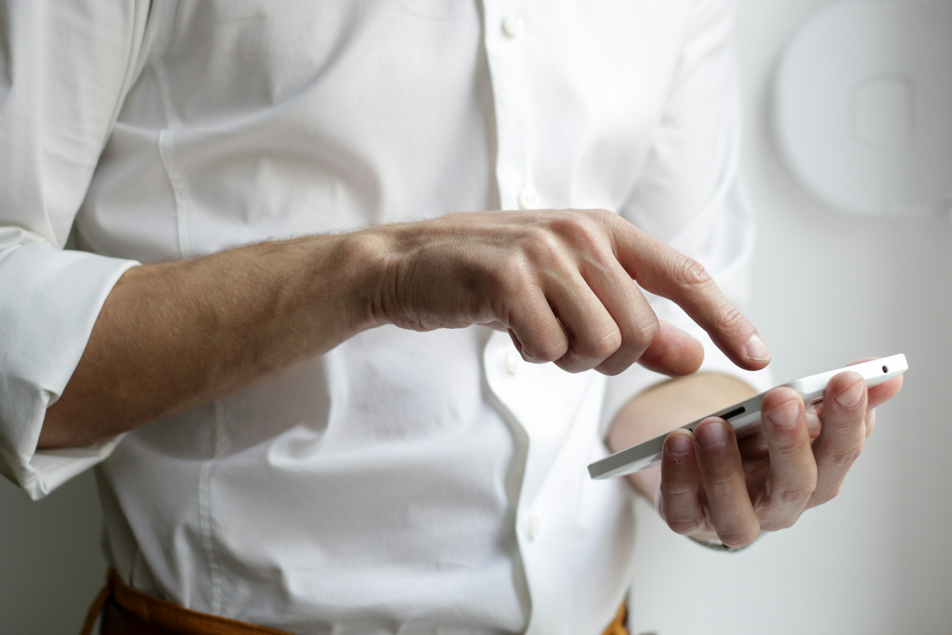 Person holding a phone while working
